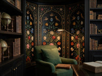The Inlaid Garden Mughal pietra dura arch wallpaper in a library reading corner with a green armchair