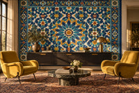 Samarkand Blue tile-look mural wallpaper in a sitting room behind a walnut sideboard, with ochre velvet armchairs and a Persian rug