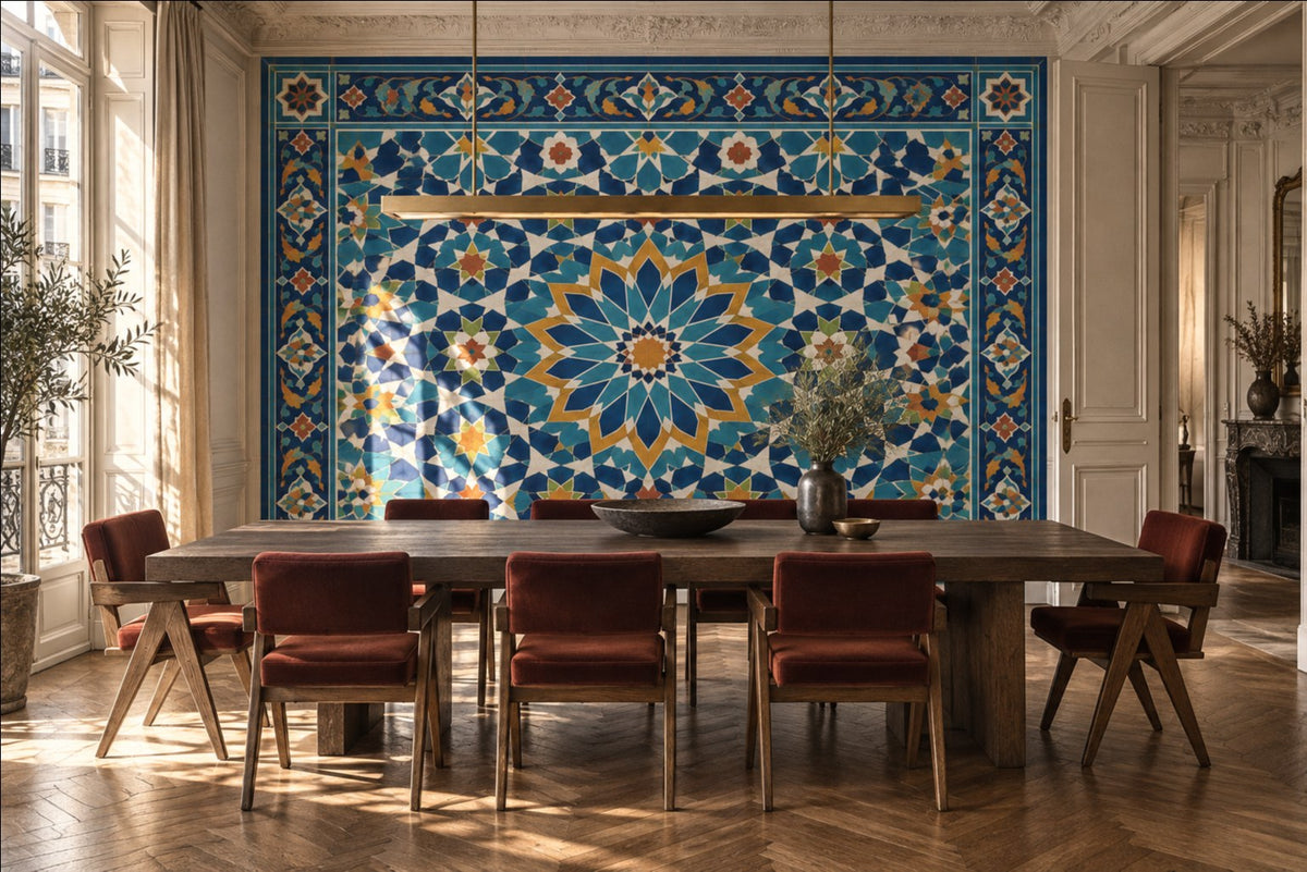 Samarkand Blue tile-look mural wallpaper in a sunlit dining room with a wooden table and red upholstered chairs