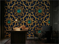 Alhambra geometric wallpaper installed as living room feature wall — Moroccan star pattern in warm neutral tones with brass and linen furnishings